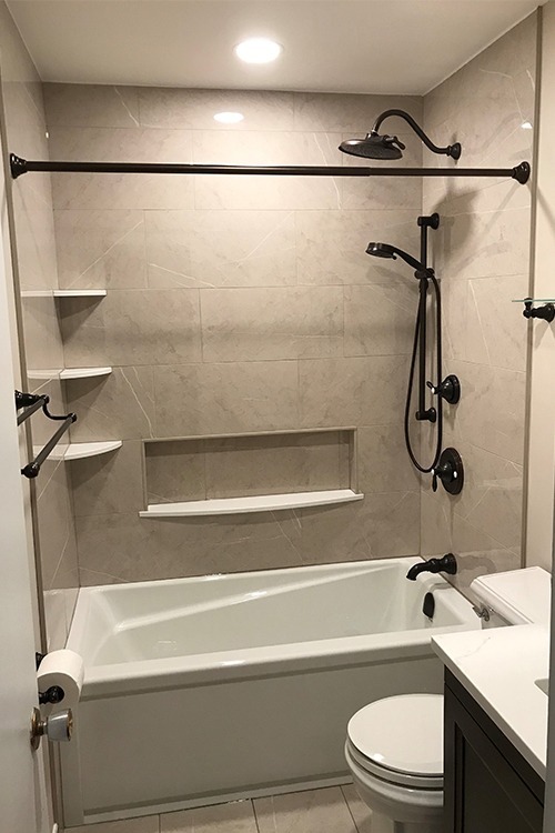 photo of modern tub and shower renovation by complete carpentry