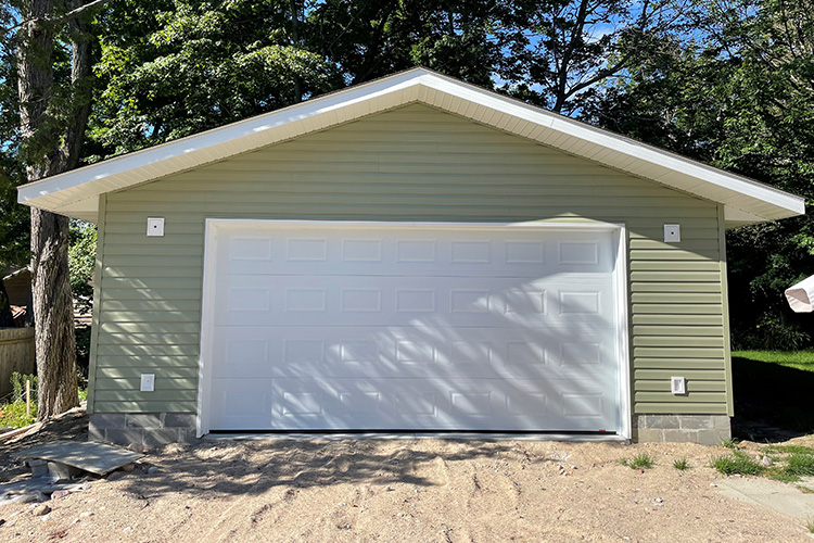 photo of green detached garage by complete carpentry