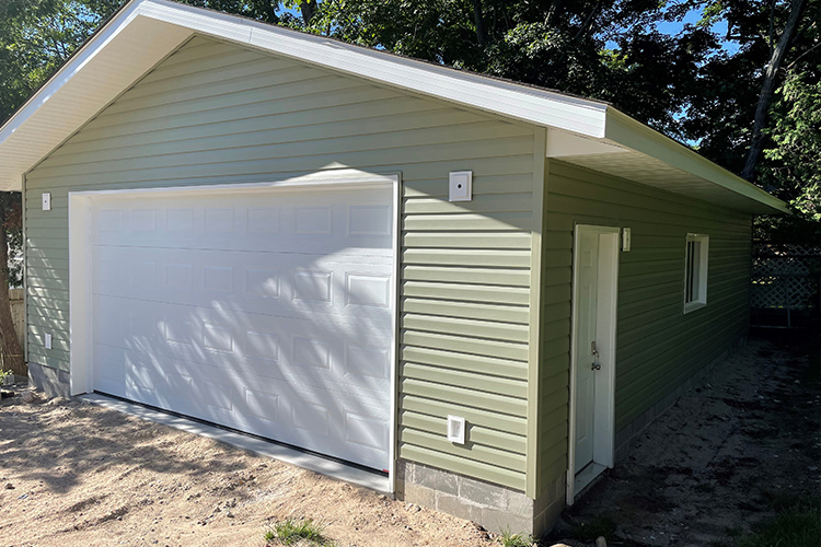 photo of green detached garage by complete carpentry